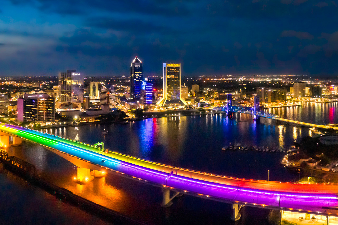 Jacksonville, Florida Skyline at night showing rainbow lights on Acosta Bridge